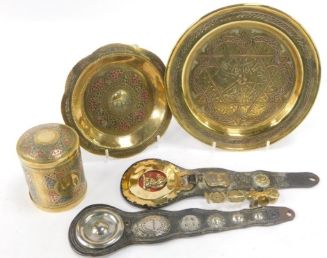 A group of Eastern wares, comprising a hammered tricolour Eastern elephant trinket box, 9cm high, two chargers, 20cm diameter and 14cm diameter respectively, a set of Harrison sovereigns scales, 10cm wide, and two horse nose pieces, one stamped J Seaton 