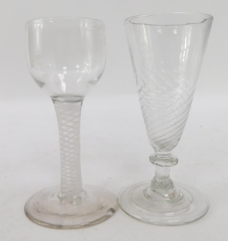 Two 19thC glasses, comprising an opaque twist stem glass, 12cm high, and a fluted glass, 12cm high. (2)