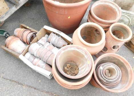 A group of terracotta flower pots, various sizes and shapes. (a quantity)