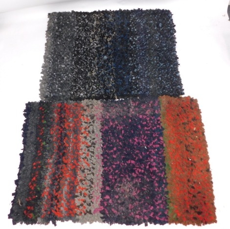 Two peg or rag rugs, one of red and brown design, another blue and orange, 150cm x 110cm, 190cm x 110cm.