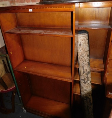 A pair of reproduction mahogany open bookcases, with dentil top and adjustable shelves, 180cm high, 92cm wide.