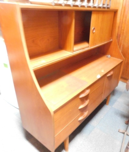 An Avalon teak side cabinet, with sliding door top and drawer and cupboard base, 136cm wide.