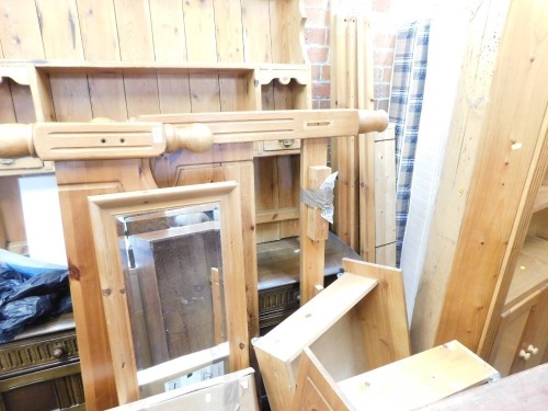 A pine double bedstead with drawers, pine dressing mirror, and a further boxed mirror. (3)