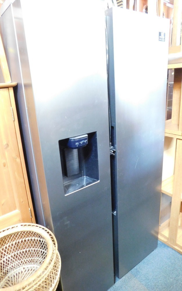 A Samsung fridge freezer, with ice and water dispenser.