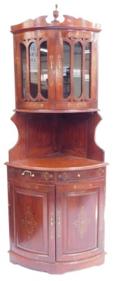 An Eastern hardwood bow front corner display cabinet, with brass inlaid decoration. (AF)