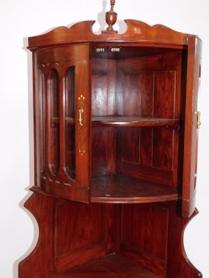 An Eastern hardwood bow front corner display cabinet, with brass inlaid decoration. (AF) - 2