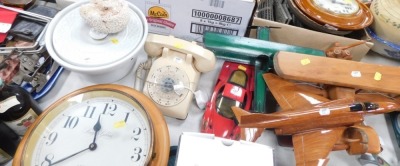 A Knights Gibbon wall clock, white tureen and cover, telephone, wooden aeroplane ornaments, model cars, etc. (a quantity)