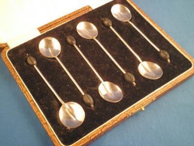 A set of six silver coffee bean spoons