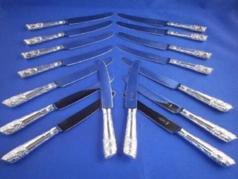A set of sixteen silver handled dinner knives