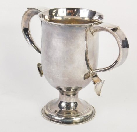 A George III silver two handled loving cup, the bell shaped body flanked by thumb mould handles on an inverted stem and circular foot, London 1797, makers marks rubbed, 16cm high, 12.48oz.