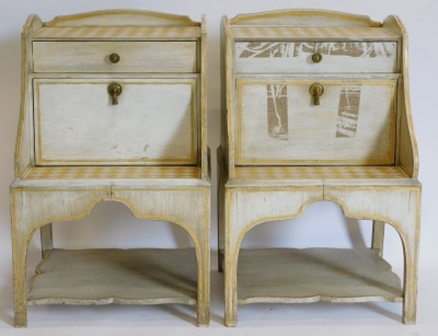 A pair of Scandinavian cream and gilt painted bedside cabinets, each with a raised gallery, with a frieze drawer and a fall front door above a platform, on shaped legs with under tier, 68cm high, 43cm wide, 43cm deep.