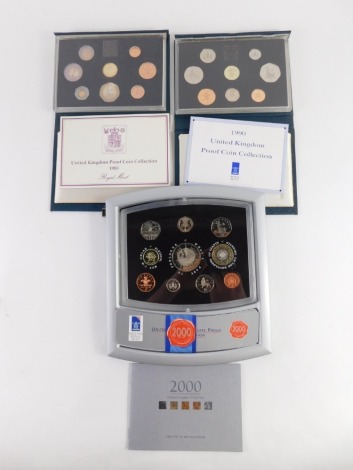 Various Royal Mint coin sets, a Deluxe Proof Edition 2000 set, and proof sets for 1983, and 1990. (3)