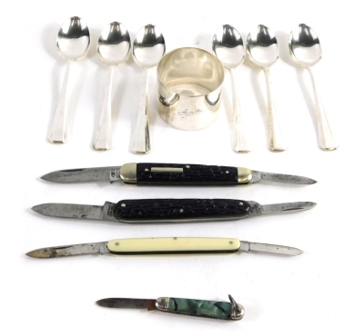 Three raised penknives, a silver napkin ring of plain form, and a cased set of plated teaspoons, the case 17cm wide.