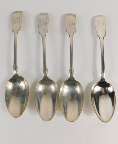 A set of three Edward VII silver spoons, fiddle pattern initialled, London 1901, 16cm long, 3.3oz, and a further plated spoon. (4)