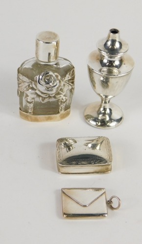 An envelope shaped stamp box, marked 925, 3cm wide, various small silver, cut glass perfume bottle with screw top, match box and small vase, 8cm high. (4)