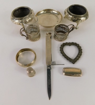 Various silver, a pair of Victorian open salts, of circular form on stepped hoof feet, an engine turned pen knife, Sheffield 1952, miniature pierced toddy cup, slender napkin ring, plain circular dish, thimble, miniature snuff box and a heart shaped frame