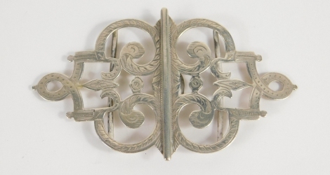 A late Victorian silver double buckle, by B. E. Walton & Co, with scroll sections, partially chased with a plain back, 5cm high 0.5oz. (2)