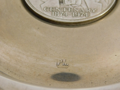 A commemorative Sir Winston Churchill silver dish, of circular form, centred by centenary coin circa 1874-1974, London 1974, 13cm diameter, and a further Sir Winston Churchill commemorative dish centred by a crown, 6.4oz all in. (2) - 6