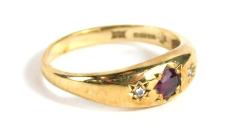 A Millennium 9ct gold dress ring, set with a garnet and white zironium, size J, 2.1g all in.