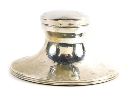 An Elizabeth II silver ink well, of circular form with hinged lid plain glass liner, and baize lined weighted foot, Birmingham 1960, 9cm diameter, and an engine turned silver matchbox case, 5.58oz all in. (2)