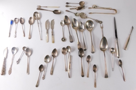 Various silver spoons, flatware, etc., a George III dessert spoon old English pattern, 17cm long, various other spoons, pickle fork with mother of pearl handle, various other teaspoons silver etc., various dates and makers, 16oz all in. (a quantity)