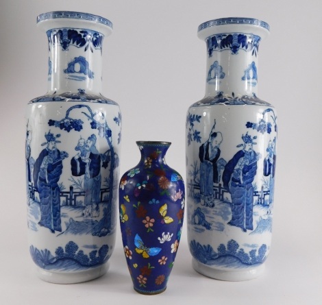 A pair of Oriental style porcelain vases, each with printed decorative with figures, children, flowering branches, etc., stamp to underside DEC711, 36cm high. (AF) and an enamel vase