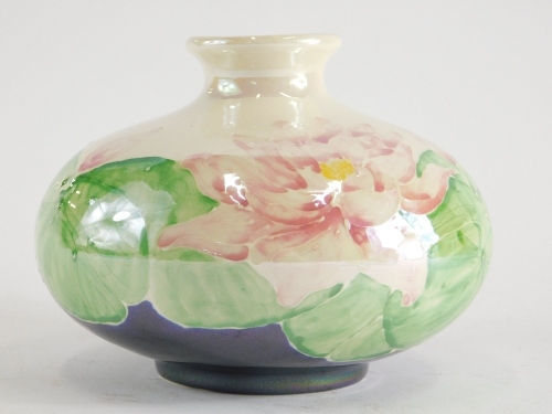 A Lisa Moorcroft Chelsea works limited edition pottery vase, with tube line decoration of pink flowers with green leaves, signed and marked to the underside and numbered 8/75, 18cm wide.