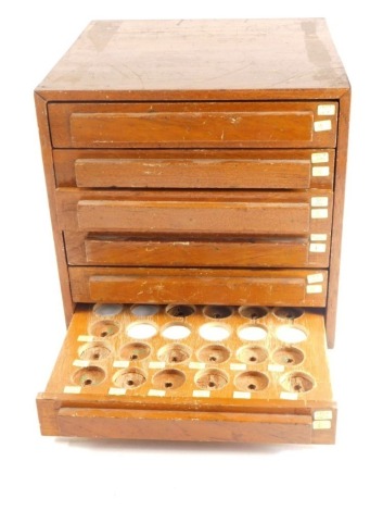 A 20thC teak tabletop coin cabinet, of rectangular form, set with six drawers, 32cm high, 30cm wide, 38cm deep.