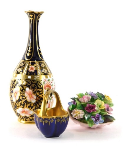 A Royal Crown Derby Imari pattern vase, number 1703, printed marks beneath, 20cm high, a Coalport miniature basket with gilt interior, and an Adderley floral posy. (3)