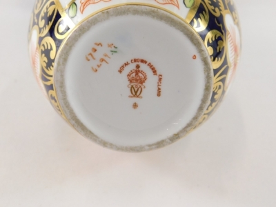 A Royal Crown Derby Imari pattern vase, number 1703, printed marks beneath, 20cm high, a Coalport miniature basket with gilt interior, and an Adderley floral posy. (3) - 2