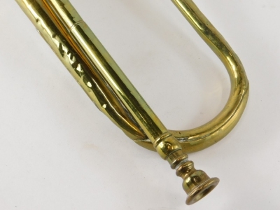 An early 20thC brass bugle, 43cm wide. - 4