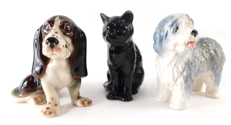 Various pottery dogs, a Sylvac Old English Sheep Dog, 13cm high, a further Basset Hound and a pottery kitten. (3)