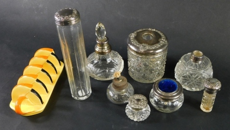 Various silver topped jars, George V and others, a cut glass hair pop with garland raised silver lid, 9cm high, various other jars, one enamel set, a Carltonware toast rack, etc. (a quantity)