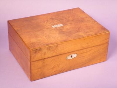 A Victorian figured walnut sewing box