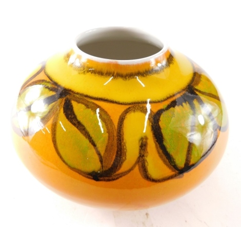 A 20thC Poole pottery Delphis style vase, floral leaf pattern on yellow and orange ground, marked AF 32 beneath, 14cm high.