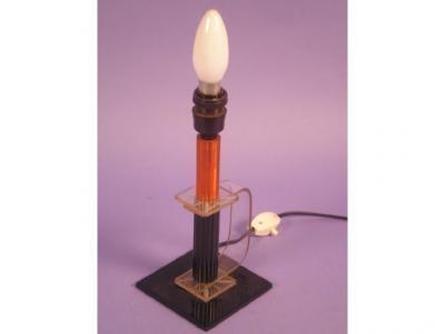 A 1930s Bakelite and early plastic table lamp with a side handle