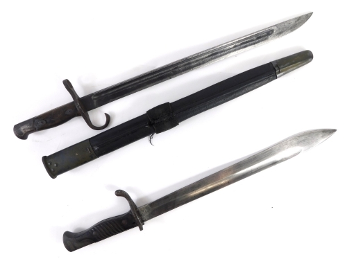 A bayonet and part shaped scabbard, with turned wooden handle, pressed eagle head hilt, and crescent marked to the textured blade, 49cm long.