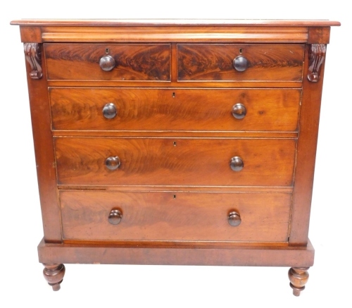 A Victorian flame mahogany chest, of two short and three long cocked beaded drawers, flanked by scrolls, on double bun feet, 127cm high, 124cm wide, 55cm deep.