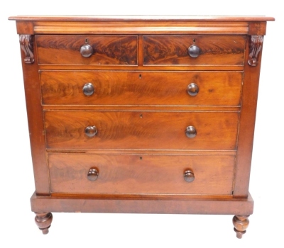 A Victorian flame mahogany chest, of two short and three long cocked beaded drawers, flanked by scrolls, on double bun feet, 127cm high, 124cm wide, 55cm deep.