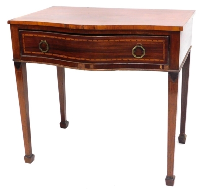 A Sheraton Revival mahogany serpentine side table, the top with a wide crossbanding and boxwood inlay, with octagonal shaped metal handles on square tapering legs, terminating in compressed spade feet, 77cm high, 88cm wide, 56cm deep.