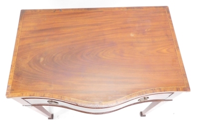 A Sheraton Revival mahogany serpentine side table, the top with a wide crossbanding and boxwood inlay, with octagonal shaped metal handles on square tapering legs, terminating in compressed spade feet, 77cm high, 88cm wide, 56cm deep. - 2