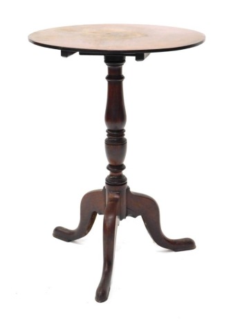 A 19thC mahogany occasional table, the circular tilt top on a turned column and tripod base, 52cm diameter.