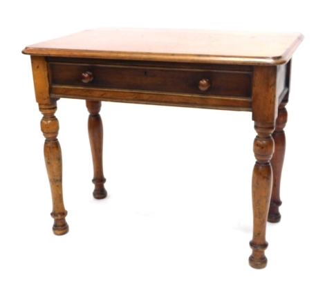 A Victorian mahogany side table, the top with rounded corners and moulded edge above a frieze drawer, on turned tapering legs, 68cm high, 84cm wide.