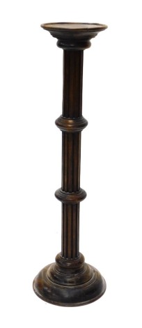 An early 20thC torchere, on reeded stem, 99cm high.