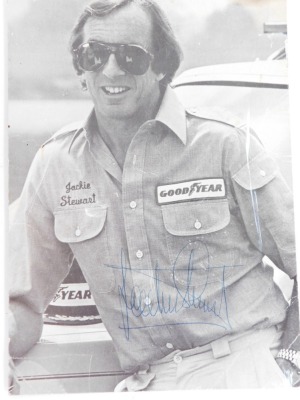 A signed photograph of Jackie Stewart, and a photograph of Jackie Stewart receiving an award from Tony Rudd at Lotus. - 2