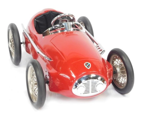 An American retro pedal car, modelled after a 1941 Alfa Romeo 158 Alfretta Formula 1 car, with rubber tyres, chrome trim and leatherette seat.