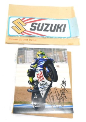 Motorbike racing interest, comprising a Valentino Rossi coloured photograph bearing biro signature, with Capital Autographs UK certificate of authenticity, Suzuki road badge, British Championship patch badges and car stickers, etc. (a quantity)