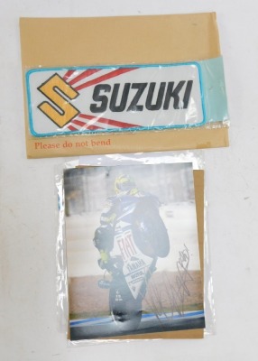 Motorbike racing interest, comprising a Valentino Rossi coloured photograph bearing biro signature, with Capital Autographs UK certificate of authenticity, Suzuki road badge, British Championship patch badges and car stickers, etc. (a quantity) - 2