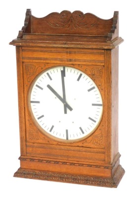 A LNER Station Master's clock, in an oak case with a fluted and moulded cornice, on a white ceramic pointed dial, 81cm high, 49cm wide, 18cm deep.