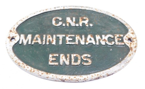 A C.N.R Maintenance Ends cast iron sign, painted on a white and green ground, oval, 32cm x 29cm.